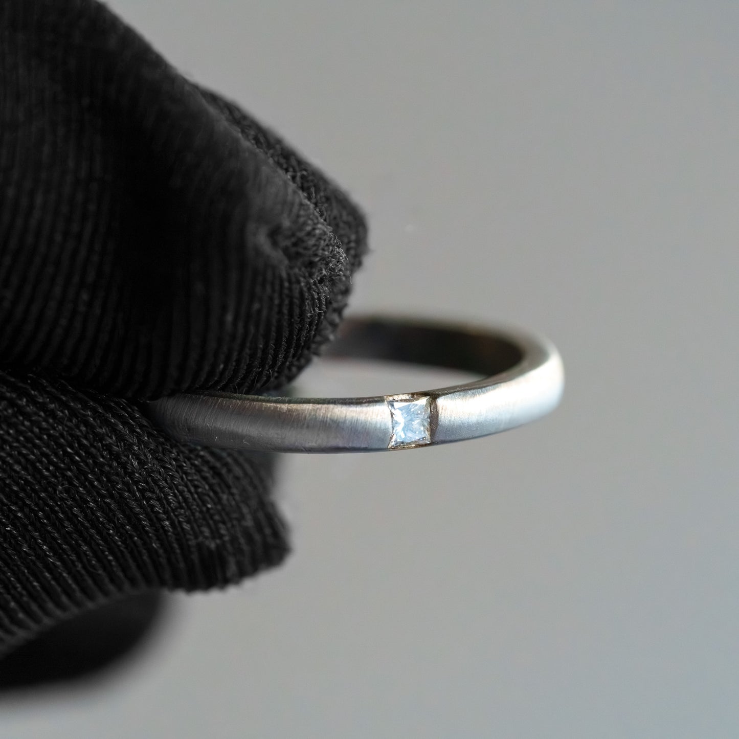 14kt White Gold Matte Tension-Set Princess Cut Diamond Band (.10ctw)